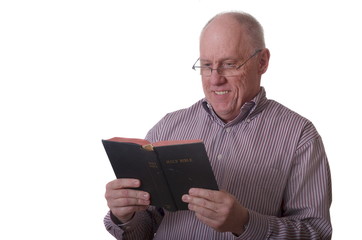 Older Bald Man in Striped Shirt and Glasses Reading Bible