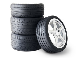 Isolated set of low section summer tyres with one wheel in front