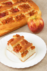 Homemade pie with apples and an apple