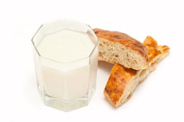 glass of milk or kefir with baton wheaten bread