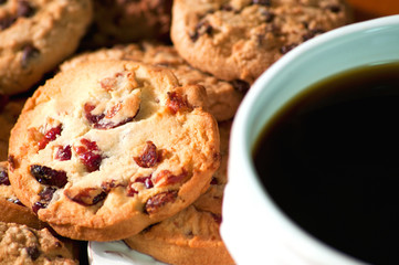 Cup of delicious black coffee with chocolate cookies