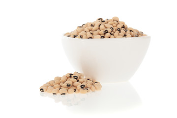 Black eyed peas beans in a bowl isolated on a white background.