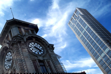 Fototapeta na wymiar Clock Tower and Office Building