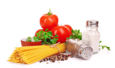 Pasta spaghetti with tomatoes, olive oil and basil on a white ba