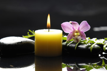 Zen-like scene with flower and candles and stones
