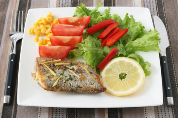 Fried swordfish with salad