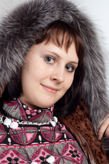 youth woman in coat with fur neck isolated