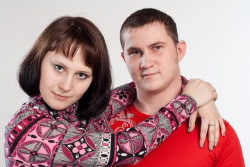 Portrait of youth couple embrace isolated