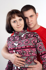 Portrait of youth couple embrace isolated