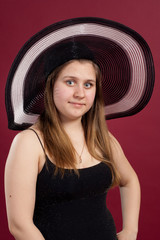 Portrait of girl in dress and  hat  isolated