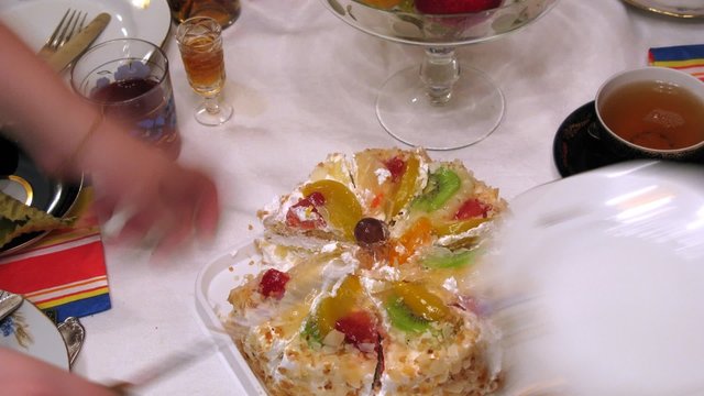 Cake is cut and then served at some banquet, time lapse