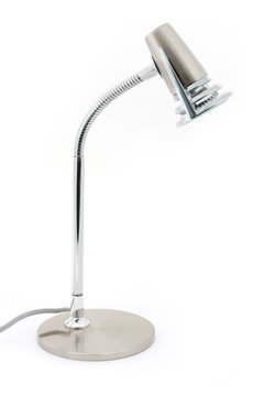 Silver halogen desk lamp over white