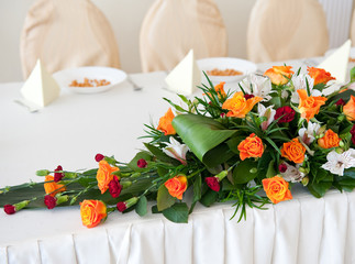 Wedding flower composition  - orange rosses