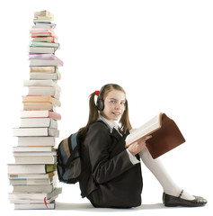Teen girl sitting at a stack of books