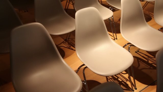 Subdued light, the rows of chairs.