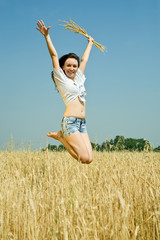 Jumping girl  with  wheat