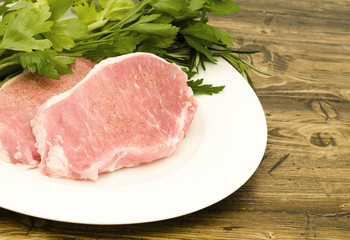 Raw pork chops with parsley
