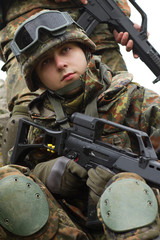 Ukrainain soldier armed with assault rifle. Armed forces of Ukraine training. Young military man...