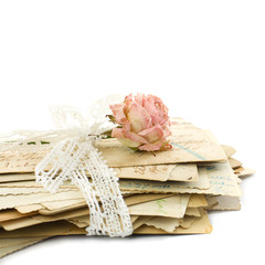 Stack of old love letters (1890-1910), lace and rose flower