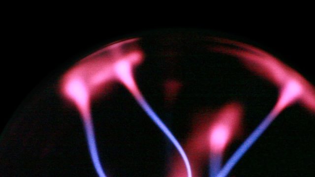 closeup of plasma ball, energy lines move inside sphere