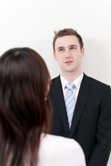a young businessman talking to woman