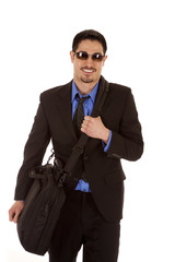 Man in suit bag glasses smile