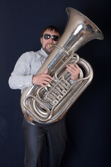man playing a tuba