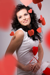 woman with red heart balloon on a white background