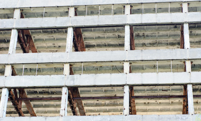 The frame of a building under demolition.Abstract background