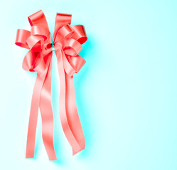 Fototapeta na wymiar Gift red ribbon isolated on blue background.