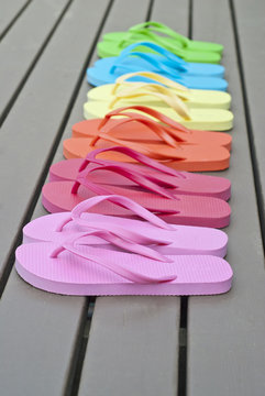 Colorful Flip Flops on a Deck