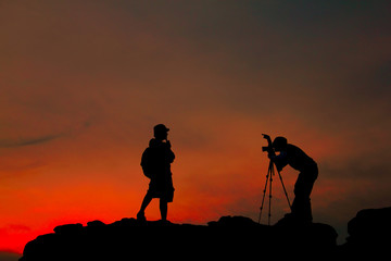 Silhouette of  photographer