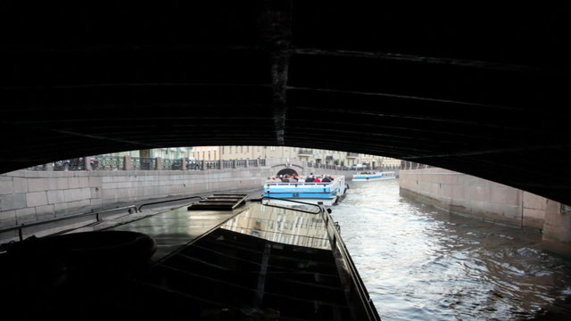 Boat floats on river channel to St. Petersburg