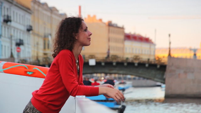 girl floats in boat on river channel to St. Petersburg