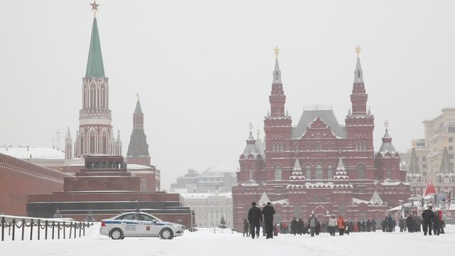 Large group of people at Moscow Red Square under snowfall