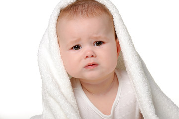 The crying baby under a towel