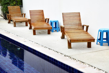 Chaise longues near pool