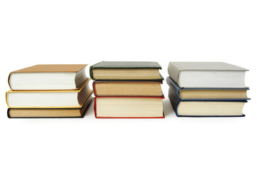 three stacks of books in hard cover, isolated