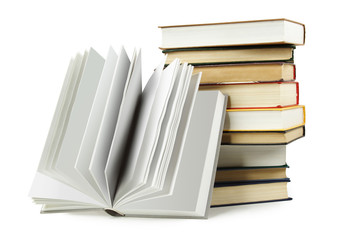 stack of books in hard cover and one opened book in front, isola