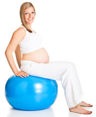 Pregnant woman excercises with gymnastic ball