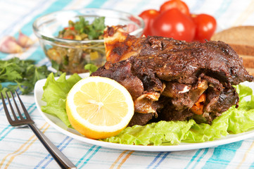 Roast leg of lamb on decorated table