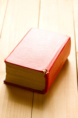 Book on the wooden background