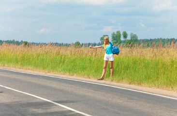 Hitchhiking girl votes on road