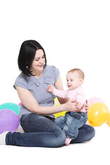 Mum plays with the eight-monthly daughter.
