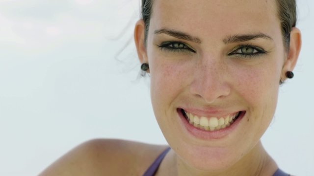 young beautiful woman smiling at camera