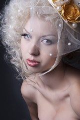 dark portrait of blonde girl in evening dress