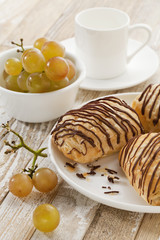 chocolate croissants, grapes and coffee