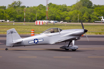 Fototapeta na wymiar Small military plane on runway