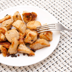 delicious chicken with potatoes on a white platter