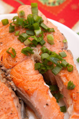 plate with tasty salmon garnished with vegetables
